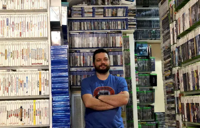 Antonio Monteiro in his video game library