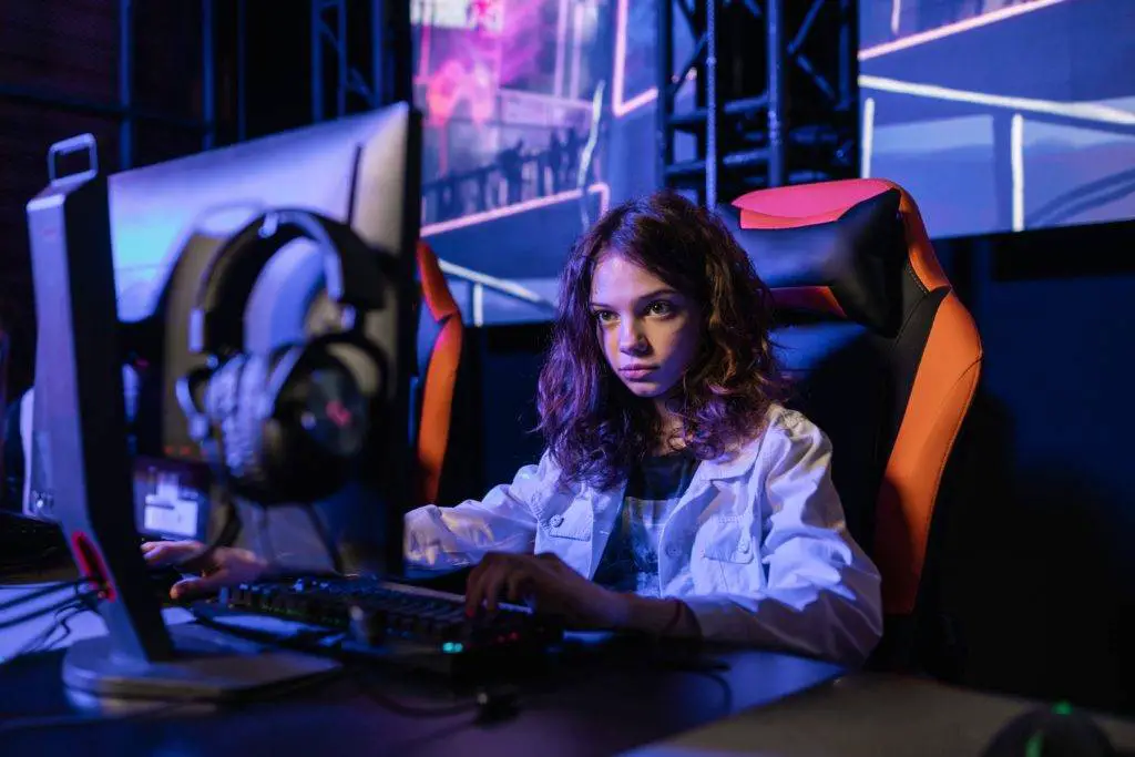 Young girl sitting on a gaming chair 