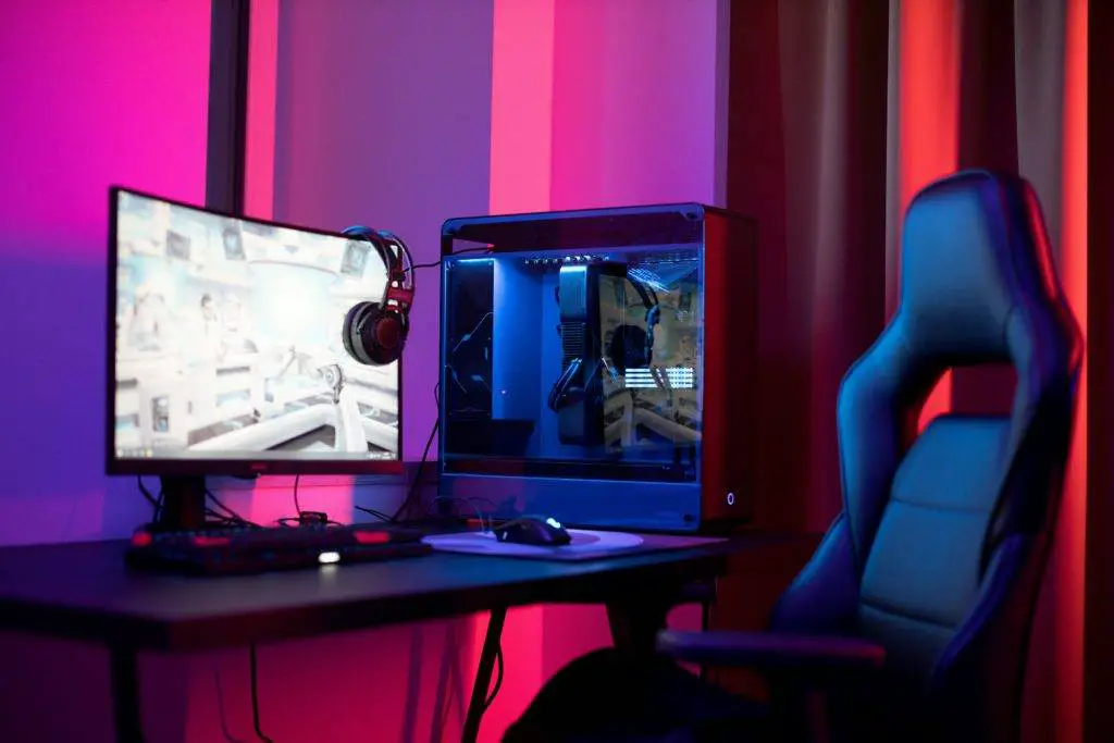 Gaming chair sitting beside a gaming rig Photo credit: Ron Lach/Pexels