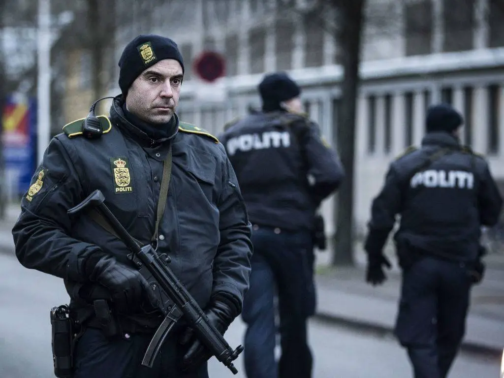 Danish police officer holding a gun