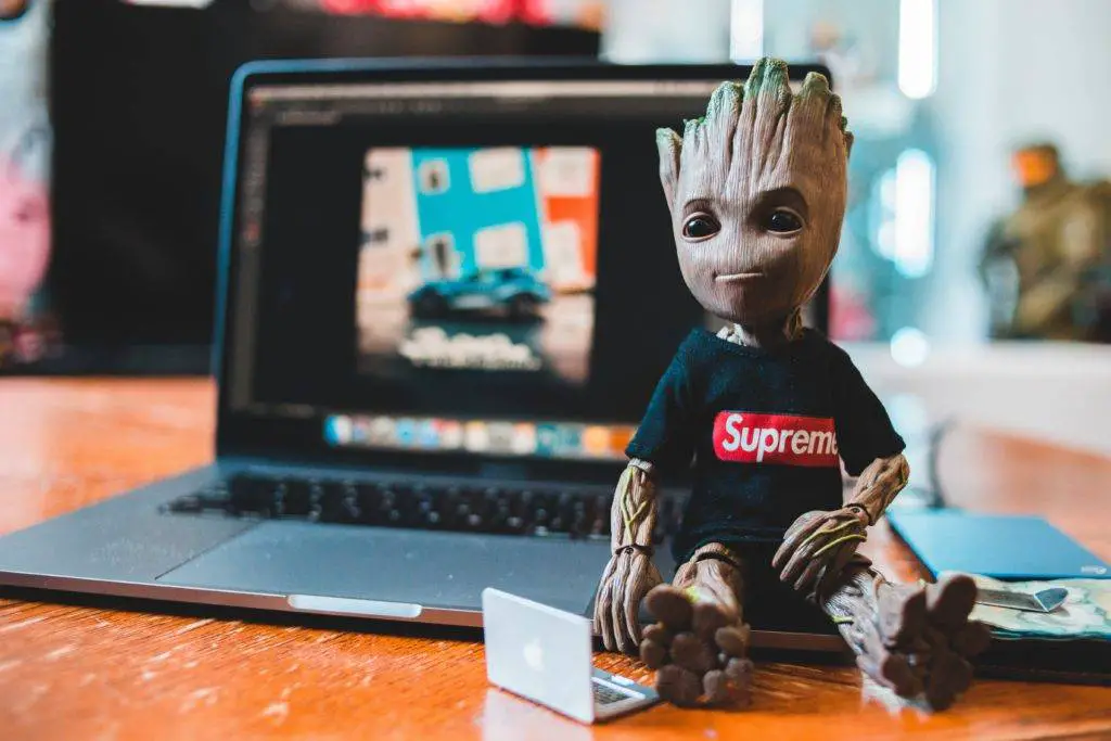 Groot sitting close to a gaming laptop (Photo credit: Erik Mclean)