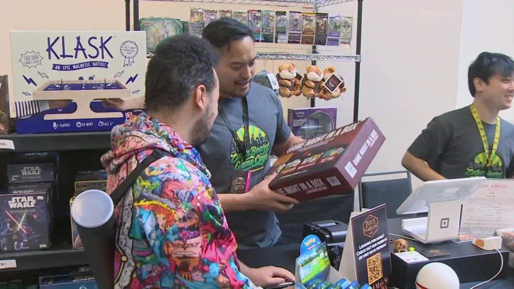 Attendees of the Emerald City Comic Con making a purchase (Photo credit: King 5 News)